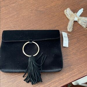Elegant Black Clutch with Tassel Accent